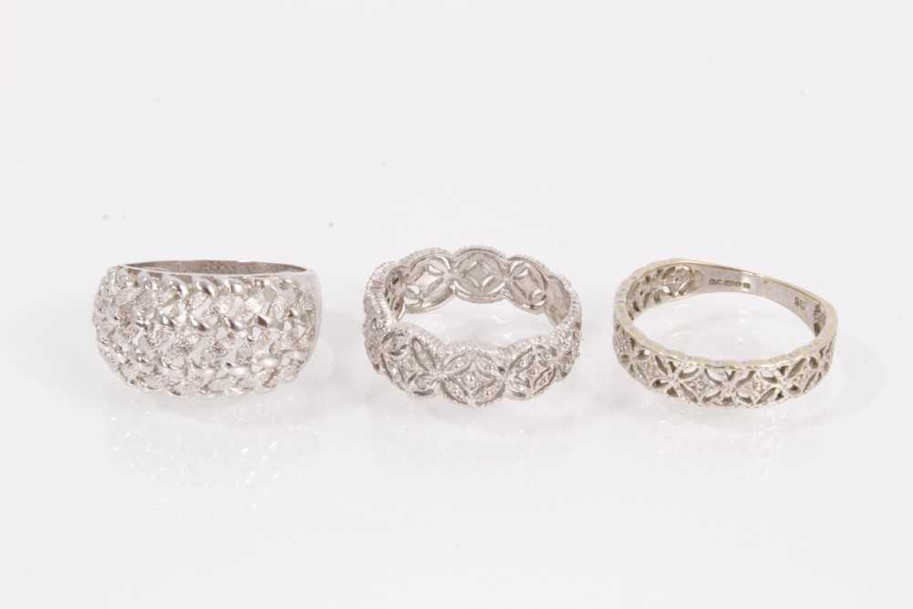 Lot 986 - Three 9ct white gold rings all with cut out designs