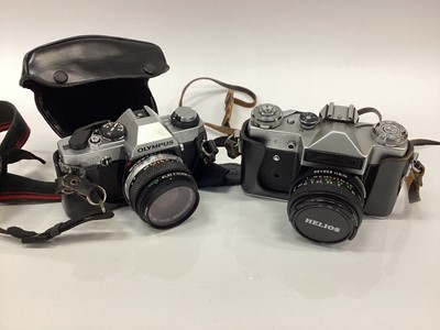 Lot 2379 - Collection of ten cameras and equipment to include Zenit-E, Canon FTb, Olympus OM20, Agfa, Koda, Polaroid, Agilux, etc