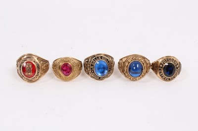 Lot 1019 - Five gold gem set college/ university rings