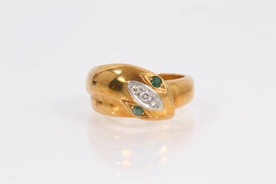 Lot 1020 - 18ct gold snake ring with diamond set head and emerald eyes