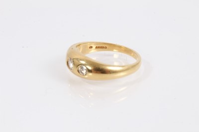 Lot 1023 - 18ct gold diamond three stone gypsy ring