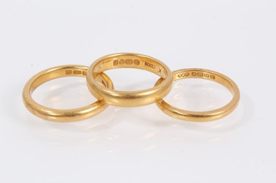 Lot 1048 - Three 22ct gold wedding rings