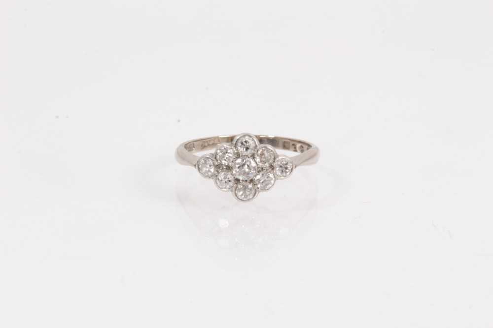 Lot 1061 - Edwardian diamond cluster ring with a marquise shape cluster of nine old cut diamonds in platinum setting on 18ct white gold shank