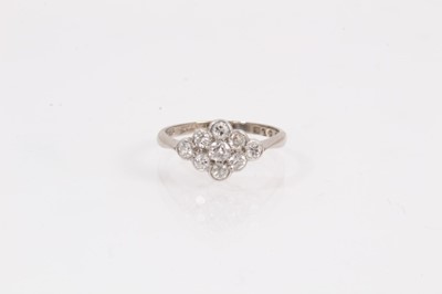 Lot 1061 - Edwardian diamond cluster ring with a marquise shape cluster of nine old cut diamonds in platinum setting on 18ct white gold shank