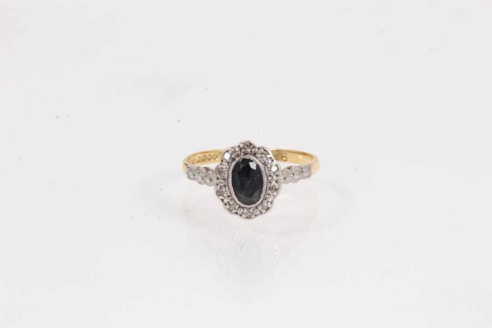 Lot 1063 - Edwardian style sapphire and diamond cluster ring