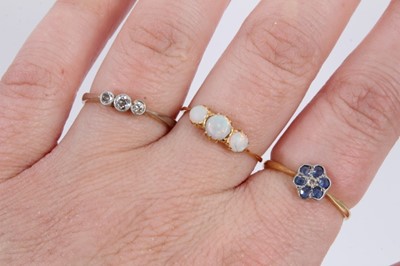 Lot 1064 - Edwardian diamond three stone ring, 18ct gold sapphire and diamond flower head ring and opal three stone ring (3)
