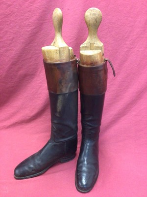Lot 915 - Pair of gentleman's black leather hunting boots with brown tops and wooden trees by Peal & Co. Ltd.