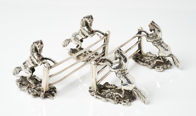 Lot 202 - Pair unusual equestrian cast silver knife rests each with twin rearing horses