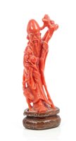Lot 727 - 19th century Chinese carved coral figure of...