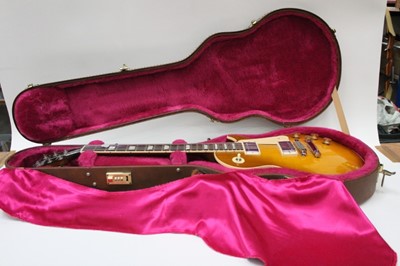 Lot 2214 - Gibson Les Paul Standard electric six string guitar, with honeyburst body, with original receipt of purchase from Coda Music, 5th August 1995. Serial number 90665582. In Gibson hard case.