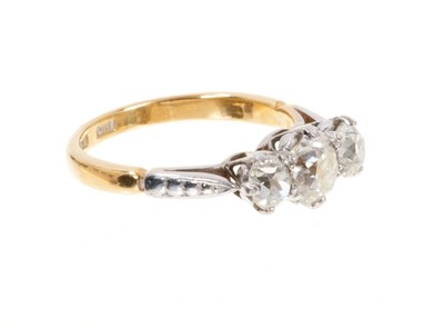 Lot 427 - Diamond three stone ring with three old cut cushion shape diamonds in platinum claw setting on 18ct gold shank. Estimated total diamond weight approximately 1.68cts