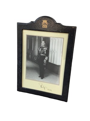 Lot 96 - HRH The Duke of Edinburgh signed framed presentation photograph in leather longmire frame, dates 1984