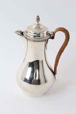 Lot 209 - Edwardian Georgian-style silver hot water pot with caned handle