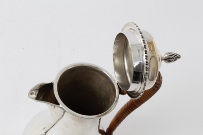 Lot 209 - Edwardian Georgian-style silver hot water pot with caned handle