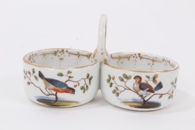 Lot 65 - A Meissen double salt with loop handle, polychrome decorated with birds, 9.5cm wide