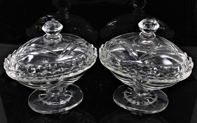 Lot 77 - A large pair of 19th century glass goblets, with facet cut bowls and knopped stems, 24cm high, together with a pair of 19th century cut glass sweetemeat dishes and covers, 18cm high (4)