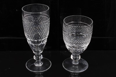 Lot 81 - Service of 21 Waterford Cashel pattern wine glasses, including twelve white wine glasses measuring 12cm high, and nine champagne flutes measuring 12.25cm high