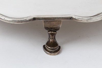 Lot 215 - Large Georgian style silver salver with piecrust edge on four hoof feet