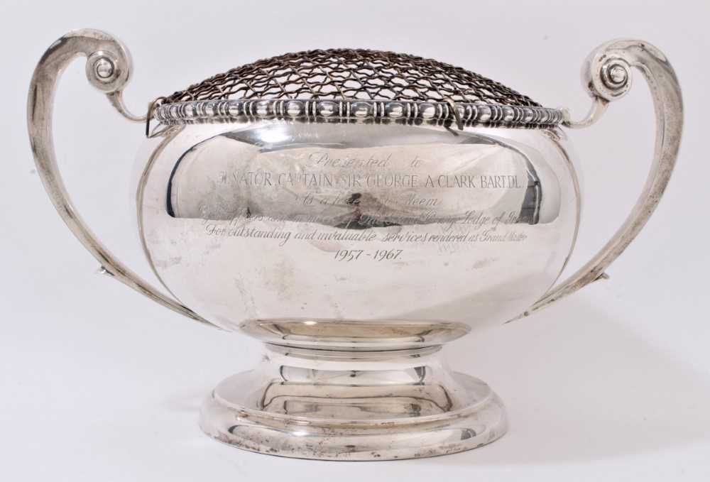 Lot 263 - 1940s silver rose bowl with twin scroll handles and pedestal base, engravedinsrption 'Presented to Senator, Captain Sir George A. Clark Bart. D.L...by members of The Grand Orange Lodge of Ireland.....