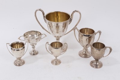Lot 907 - Group of six miniature silver two handled trophies to include The Dunlambert Cup, North Down Harriers Hunt Club and others, various dates and sizes, all at 13ozs