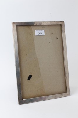 Lot 265 - George V silver photograph frame of rectangular form with easel back, Sanders & Mackenzie (Birmingham 1915), 30.5cm overall height.