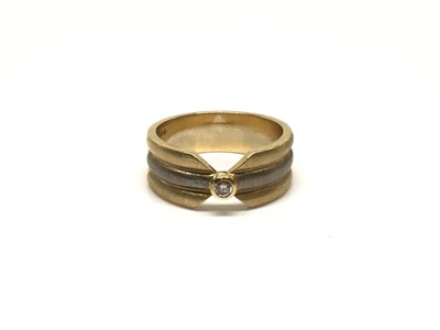 Lot 206 - Two colour gold (stamped 750) diamond single stone ring