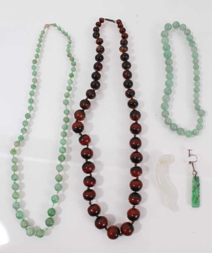 Lot 490 - Chinese jade bead necklace, one other, a  jade pendant, jade earring, and tortoiseshell/horn bead necklace