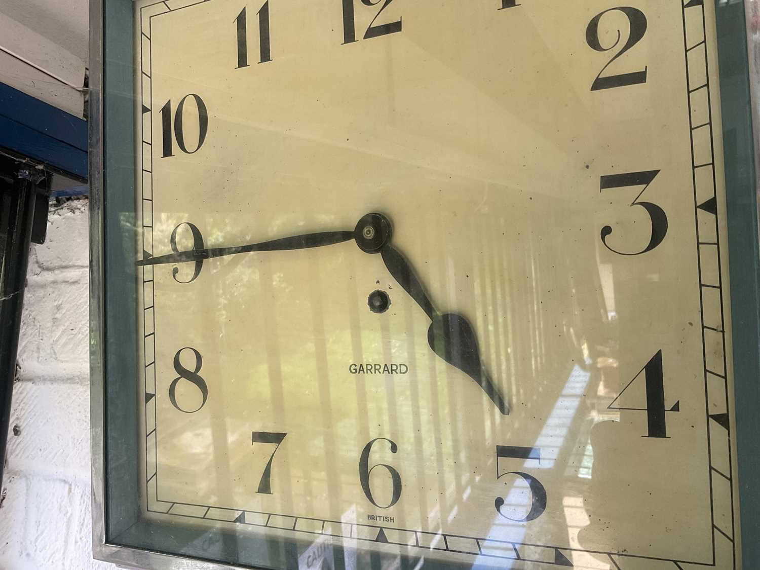 Lot 146 Art Deco square face wall clock by Garrard