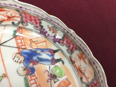 Lot 89 - A Chinese famille rose saucer, painted with acrobats, Qianlong