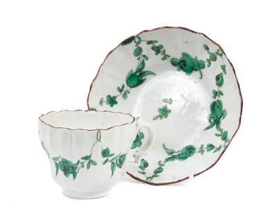 Lot 112 - A Bristol ogee shaped coffee cup and saucer, painted in green monochrome, circa 1775