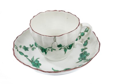 Lot 112 - A Bristol ogee shaped coffee cup and saucer, painted in green monochrome, circa 1775