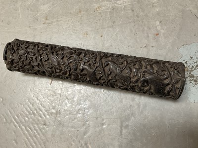 Lot 209 - 18th/19th century Indian carved hardwood quill case decorated in high relief with birds and animals and scrolling foliate arabesque, 23cm high