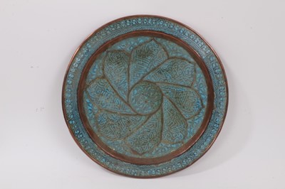 Lot 759 - Antique Islamic copper and enamelled dish, moulded with flower head, with script and arabesque ornament, 30cm diameter