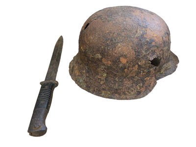 Lot 62 - First World War helmet and a bayonet