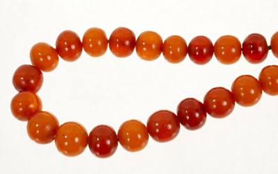Lot 492 - Old amber necklace with a string of graduated amber beads. Approximately 57cm length.