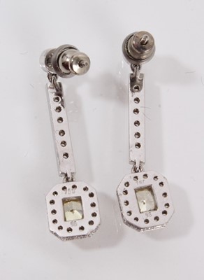 Lot 460 - Pair of yellow diamond and white diamond pendant earrings, each with a rectangular cushion cut yellow diamond measuring approximately 4.3mm x 3.6mm x 2.4mm surrounded by brilliant cut diamonds susp...