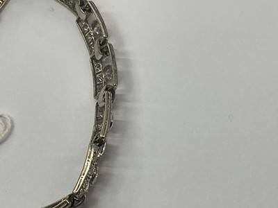 Lot 418 - Art Deco style diamond bracelet articulated rectangular openwork panels, each with a round brilliant cut diamond within a diamond border, in white gold setting. Estimated total diamond weight appro...