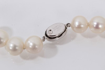 Lot 739 - Cultured pearl necklace with a string of 10.5mm-11.5mm cultured pearls suspending a detachable pear shaped cultured pearl pendant drop, 47cm.