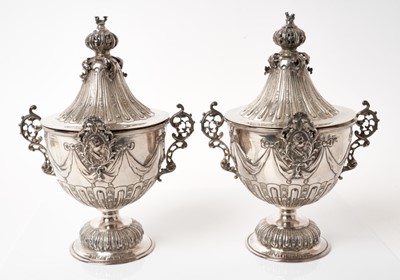 Lot 267 - Pair late 19th century Continental silver (930) urns and covers in the 18th century taste with cast profile busts and swag decoration each raised on fluted bell-shaped foot, import marks for Sheffi...