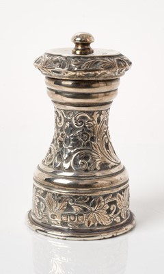 Lot 269 - Victorian silver pepper grinder with cast floral scroll decoration, (London 1898), 10cm