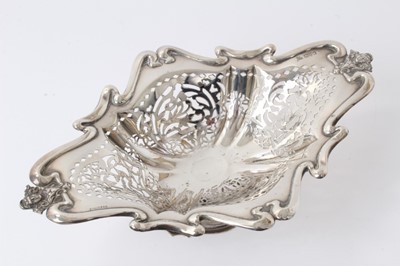 Lot 271 - Edwardian pierced silver bon bon dish on pedestal, (Chester marks rubbed) 25.5cm and set three Victorian pierced silver oval dishes, Sheffield 1895, 12cm