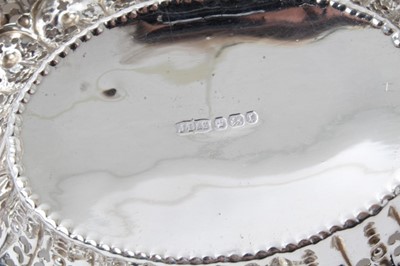 Lot 271 - Edwardian pierced silver bon bon dish on pedestal, (Chester marks rubbed) 25.5cm and set three Victorian pierced silver oval dishes, Sheffield 1895, 12cm