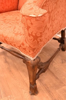 Lot 1405 - Carolean style walnut wing armchair, with breganza feet