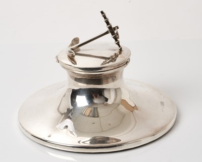 Lot 279 - Of Naval interest, silver capstan inkwell with anchor mount to lid, blue glass liner, (London 1913), 14cm diameter