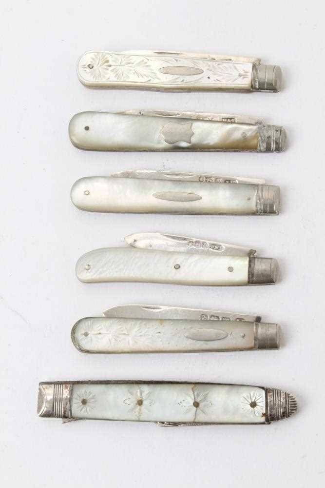 Lot 283 - Five 19th century and later silver and mother of pearl folding fruit knives and one rare folding fork (6)