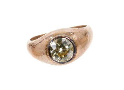 Lot 445 - Antique diamond single stone ring with an old cut diamond of pale yellow tint, estimated to weigh approximately 1.10cts in rub-over setting on rose gold shank. Ring size O.