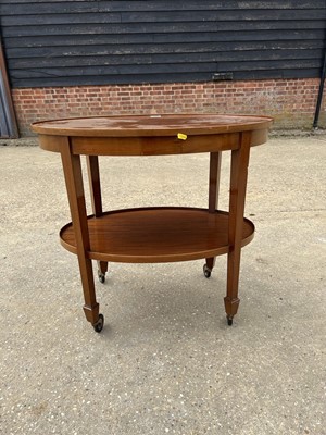 Lot 76 - Early 20th century mahogany oval two tier trolley