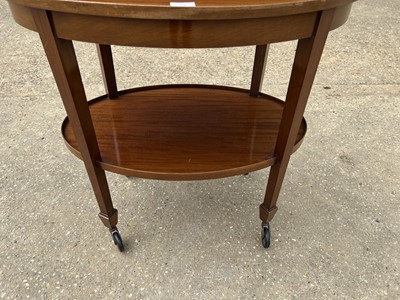 Lot 76 - Early 20th century mahogany oval two tier trolley