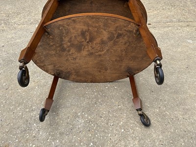 Lot 76 - Early 20th century mahogany oval two tier trolley