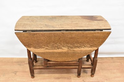 Lot 1277 - 17th century oak drop leaf table